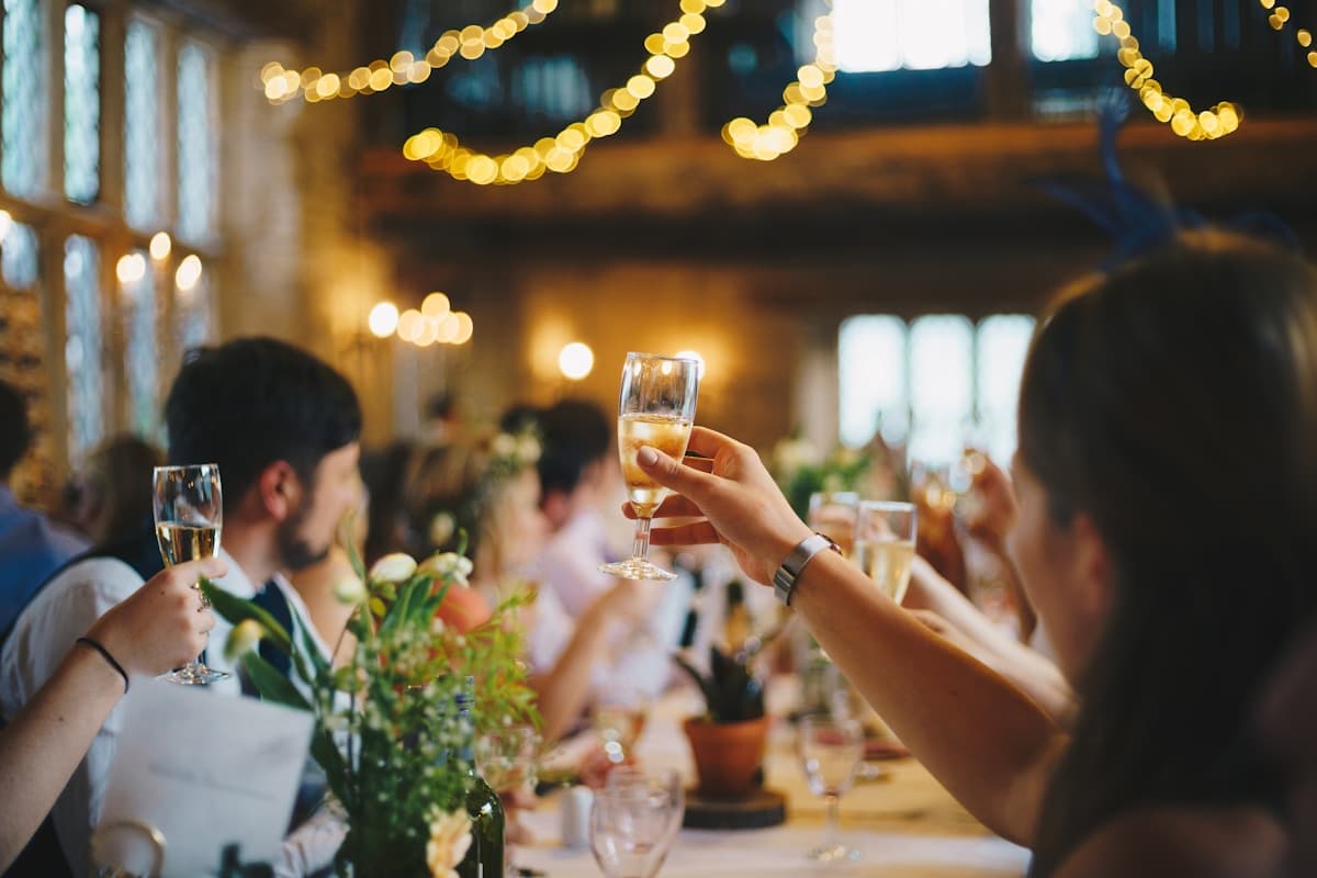 A toast under string lights